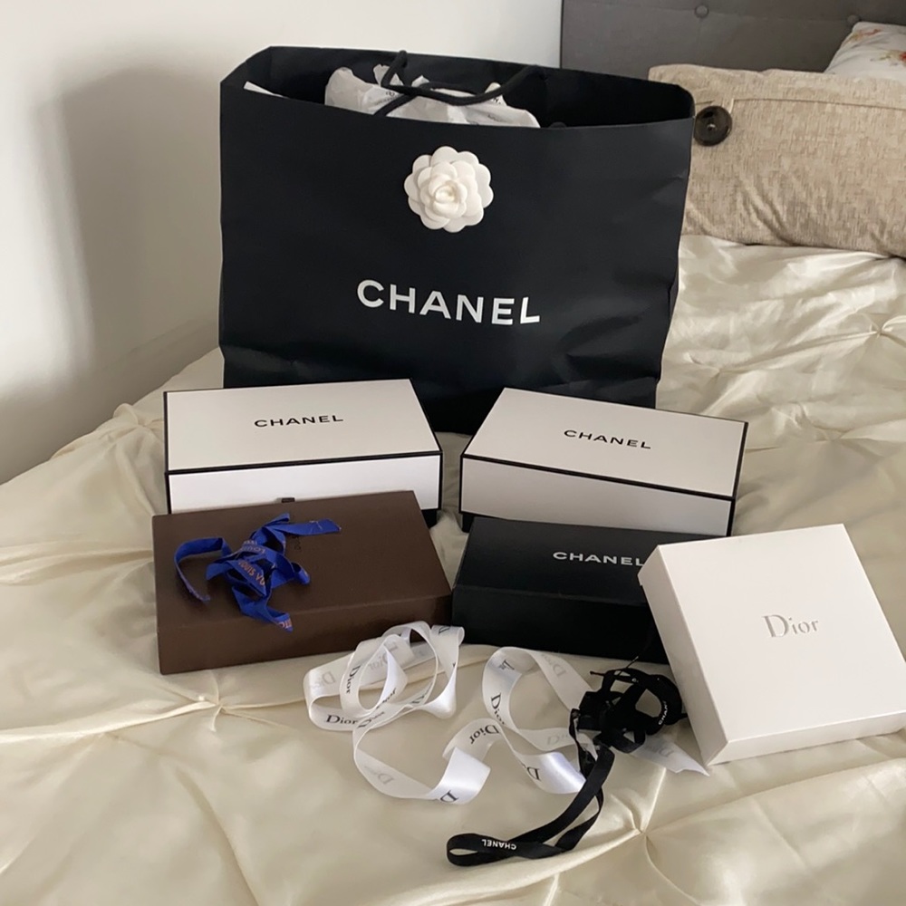 A bundle of boxes and Chanel shopping bag